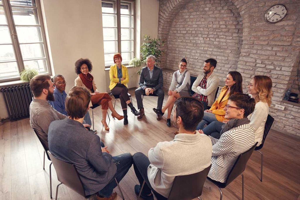 group sitting in circle in inpatient treatment