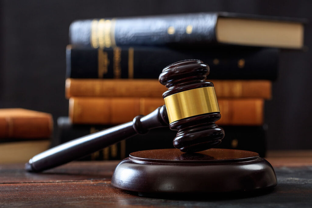 a gavel and some law books that discuss mississippi alcohol laws