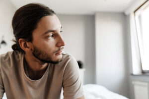 a man struggles through symptoms of heroin withdrawal in detox