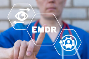 a medical professional points at EMDR symbol while answering a persons question about how does emdr therapy work