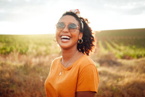 a person smiles after learning about the power of acceptance in recovery