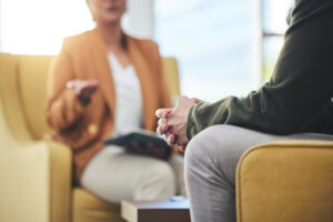a person talks to a therapist about trading addictions