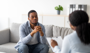 man sits and is talking to professional and asks how addictive is marijuana