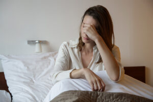 woman in bed is struggling with symptoms of a meth relapse