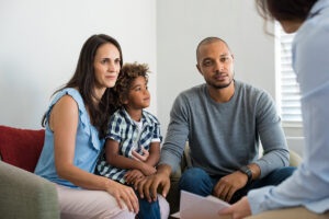 parents and a child talk to a family therapist about how addiction affects families