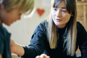 a person talks to their child after they got sober with medication-assisted treatment