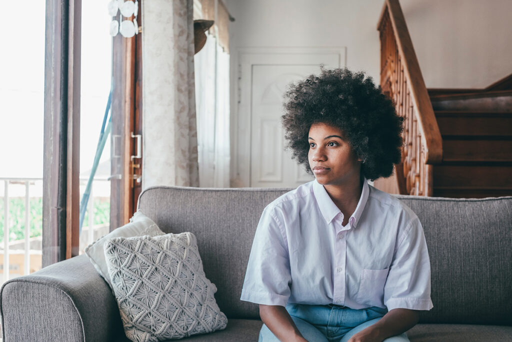 a person looks hopeful after learning about the stages of addiction recovery
