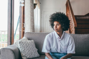 a person looks hopeful after learning about the stages of addiction recovery